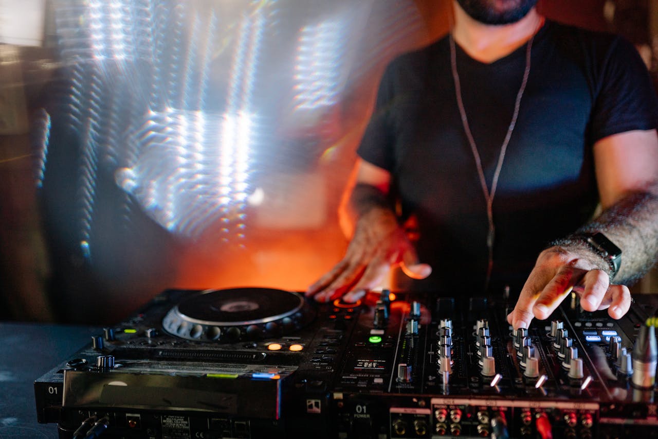 Man in Black T-Shirt Playing Dj Mixer